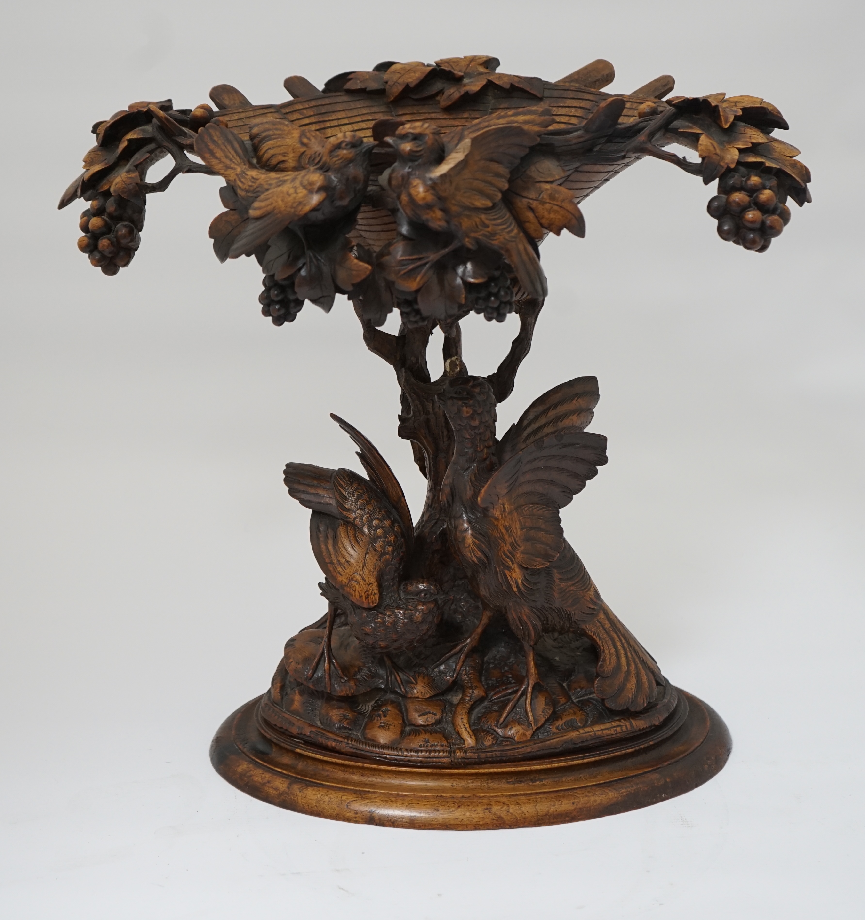 A 19th century Black Forest carved wood centrepiece